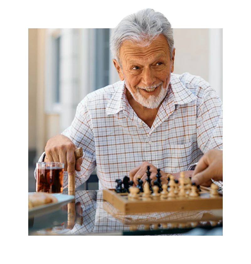 Senior playing chess
