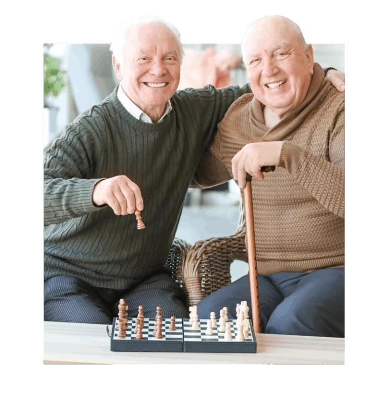 Seniors smiling playing chess