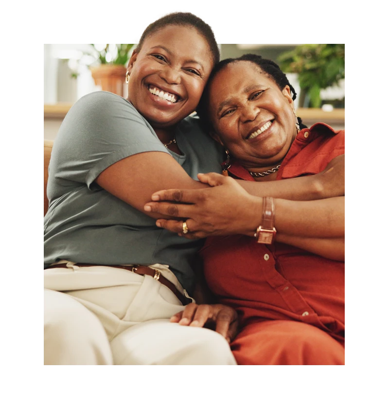 Senior smiling and hugging woman