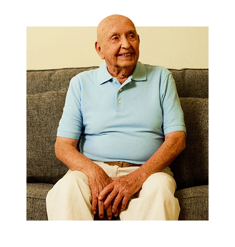 Senior smiling on couch