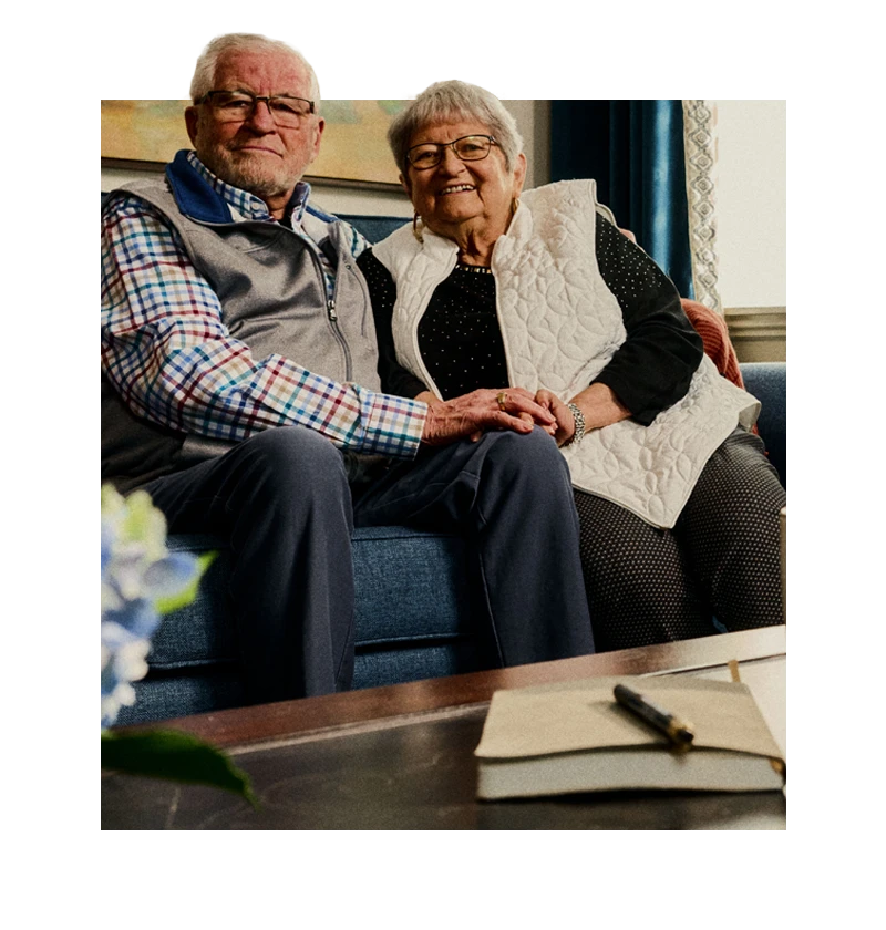 Seniors sitting together on couch