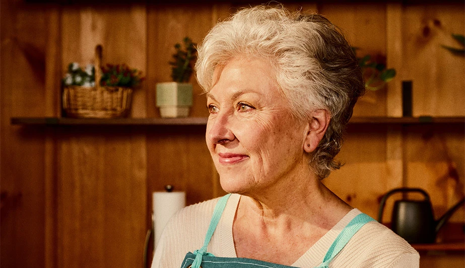 Healthy woman in garden center smiling